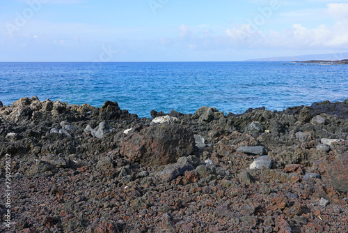 View of black lava rock and blue ocean at the Ahihi-Kinau Natural Area Reserve, on the West shore of Maui south of Wailea and Makena, Hawaii © eqroy