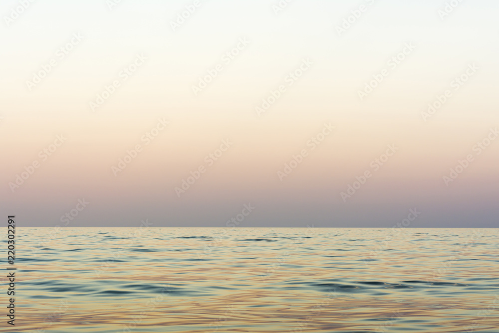 the night sea with waves and reflection of the sky after sunset, sea sky at sunset time, nature abstract background