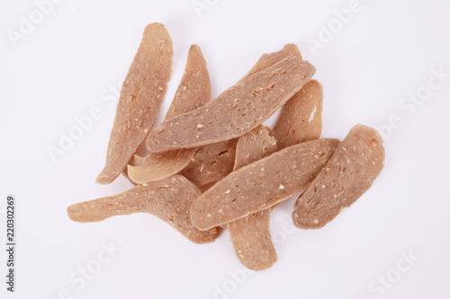 Home made raw fish cracker on white background. photo