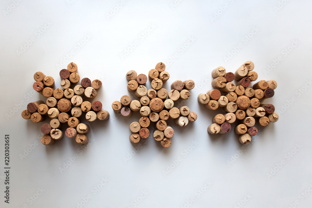 Wine corks snowflakes on white background from a high angle view Wine corks snowflakes on white background from a high angle view