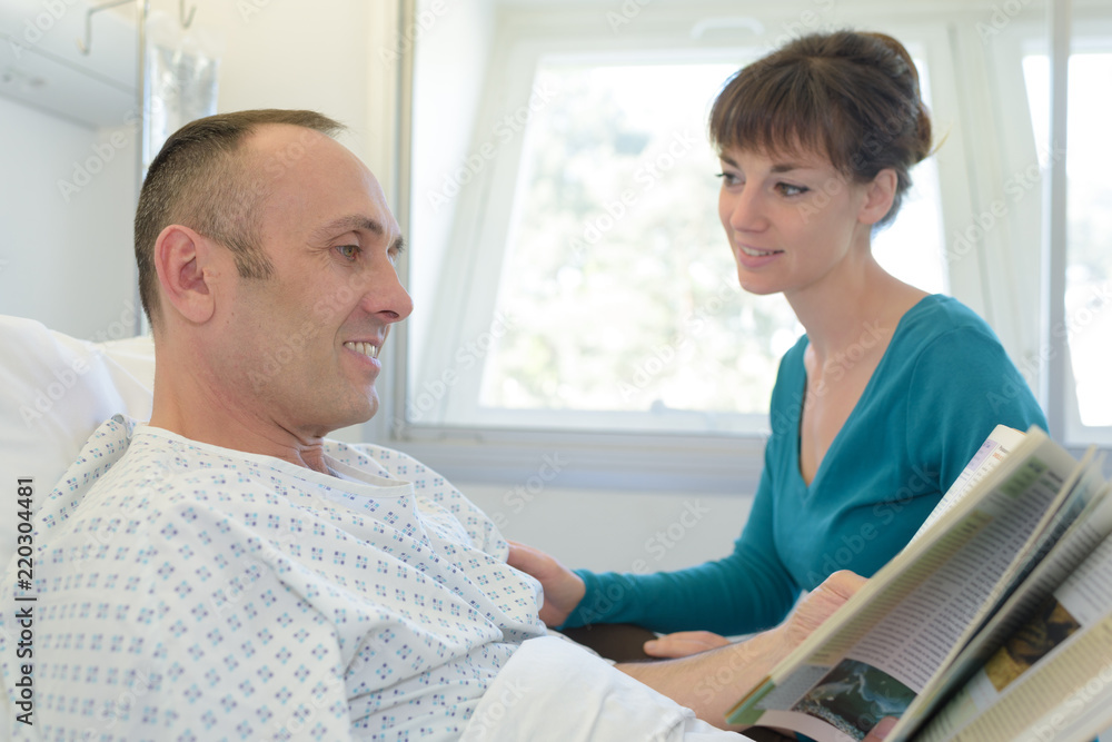 sick man in hospital reading sick man in hospital reading