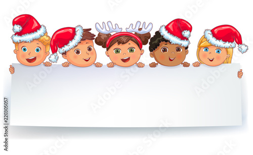 Cute kids in caps Santa Claus holding white blank banner