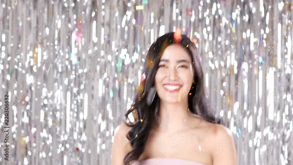 Asian woman dancing with attractive smile at party event. People with party, celebration, new year concept. Asian woman dancing with attractive smile at party event. People with party, celebration, new year concept.