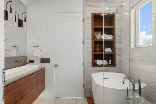 modern white and wood master bathroom with bath and shower