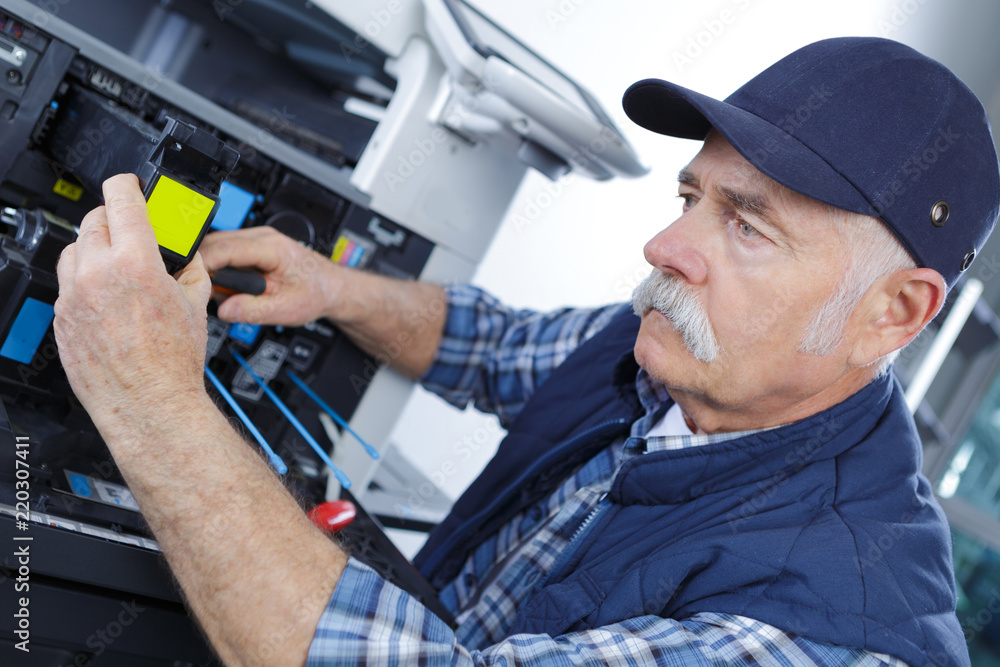 Fototapeta premium senior worker repair assistance