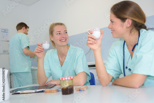 medical doctor with nurses on coffee break photo