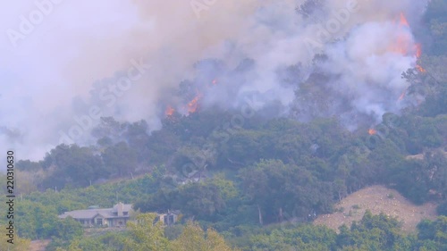 2017 - the Thomas Fire rages above large mansions near Montecito, Santa Barbara County, California. photo
