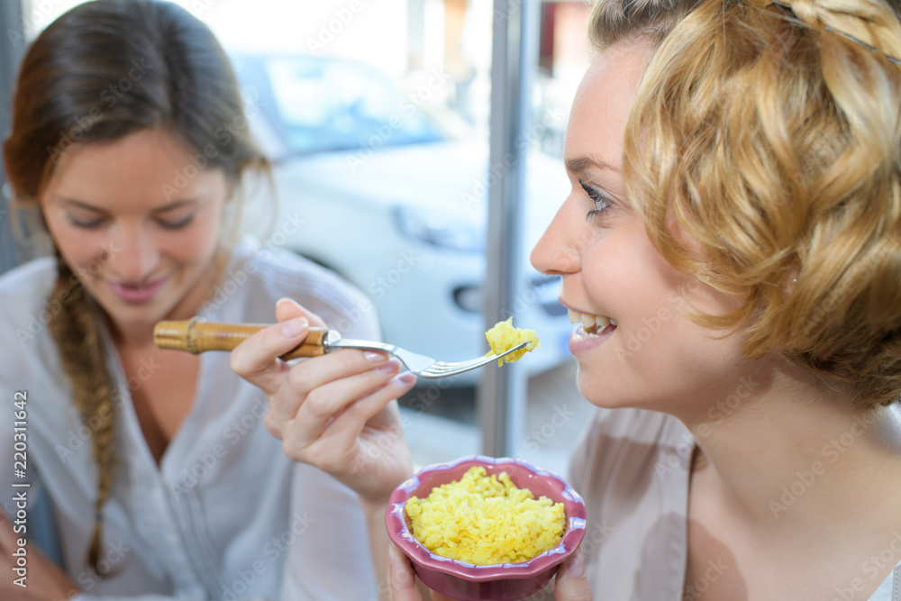 two female friends having luncg two female friends having luncg