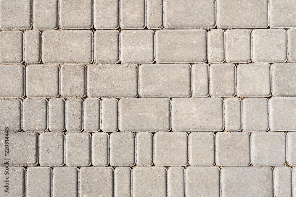 Stone tile background. Grey textured fond. Different sized pavement Stone tile background. Grey textured fond. Different sized pavement