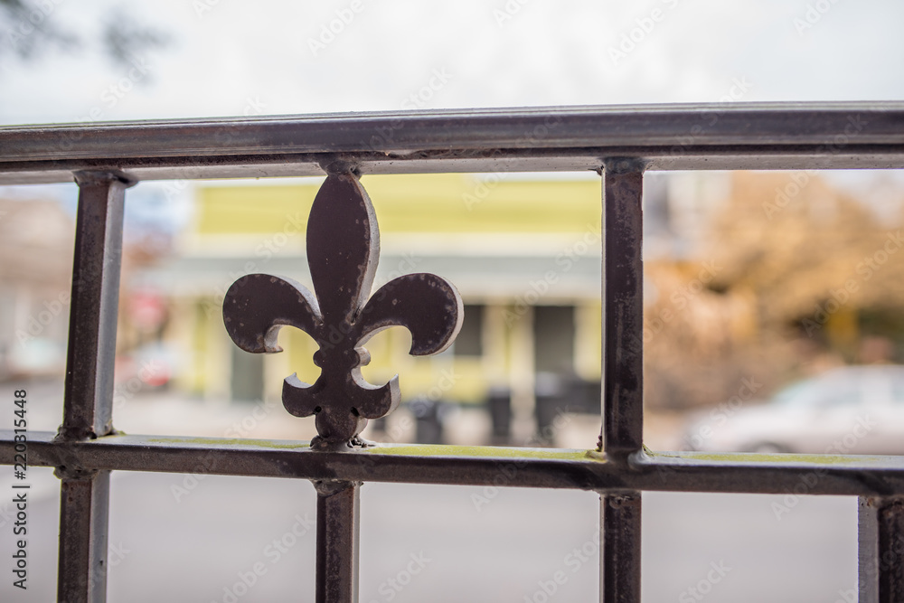 The famous "Fleur De Lis" symbol in iron on a gate in an old