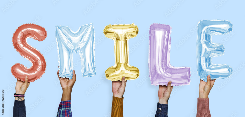Hands showing smile balloons word