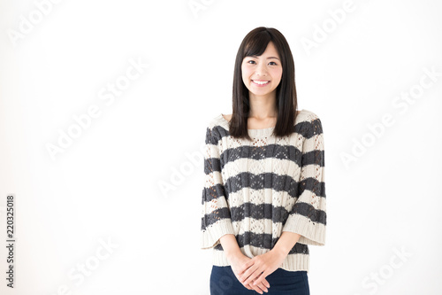 portrait of young asian woman relaxing on white background