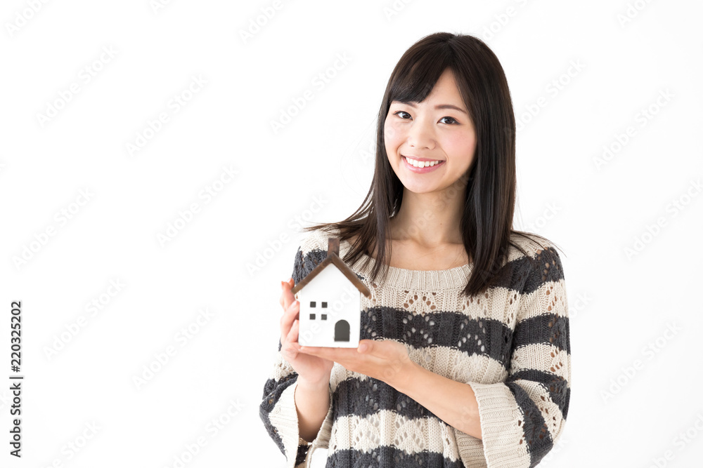 portrait of young asian woman holding miniture house on white background portrait of young asian woman holding miniture house on white background