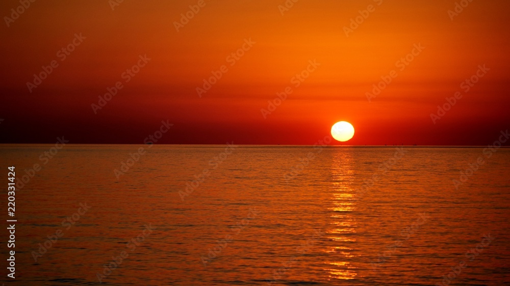 Full sun disc over the Black Sea, Sunset in Sochi