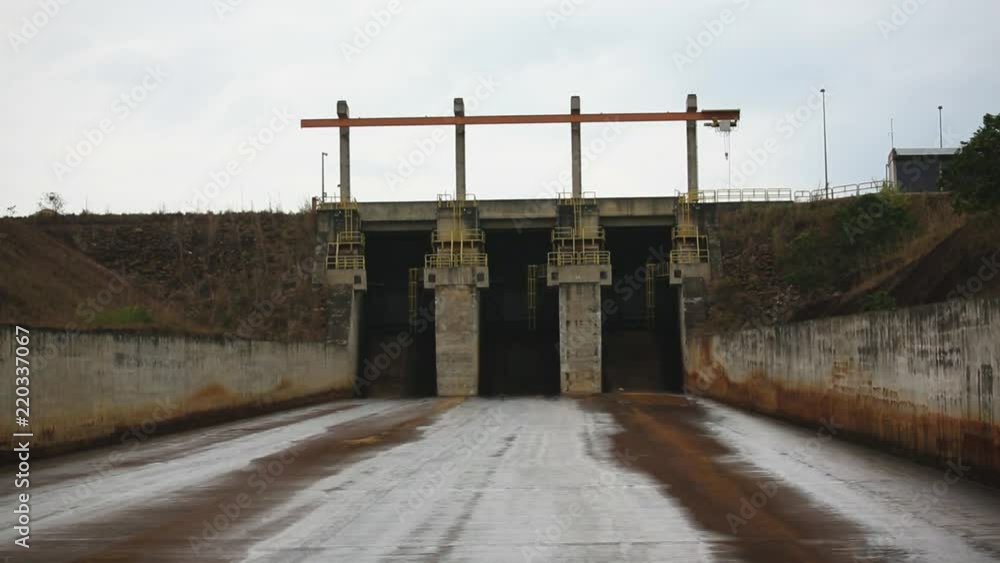 Long shot of a closed waterway gate at a hydroelectric power plant in Brazil Long shot of a closed waterway gate at a hydroelectric power plant in Brazil