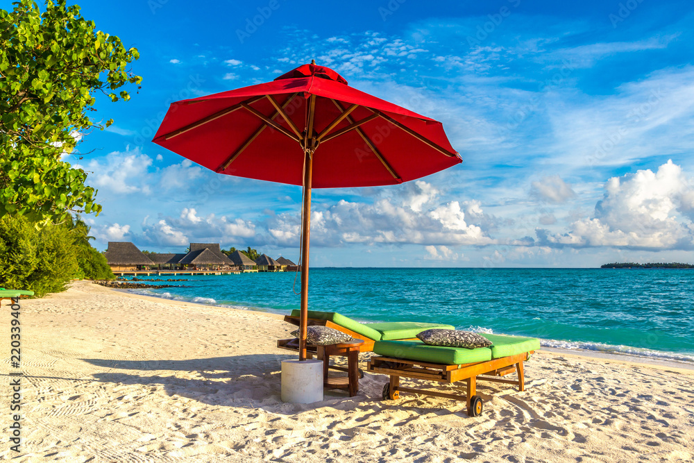 Sunbed and umbrella in the Maldives