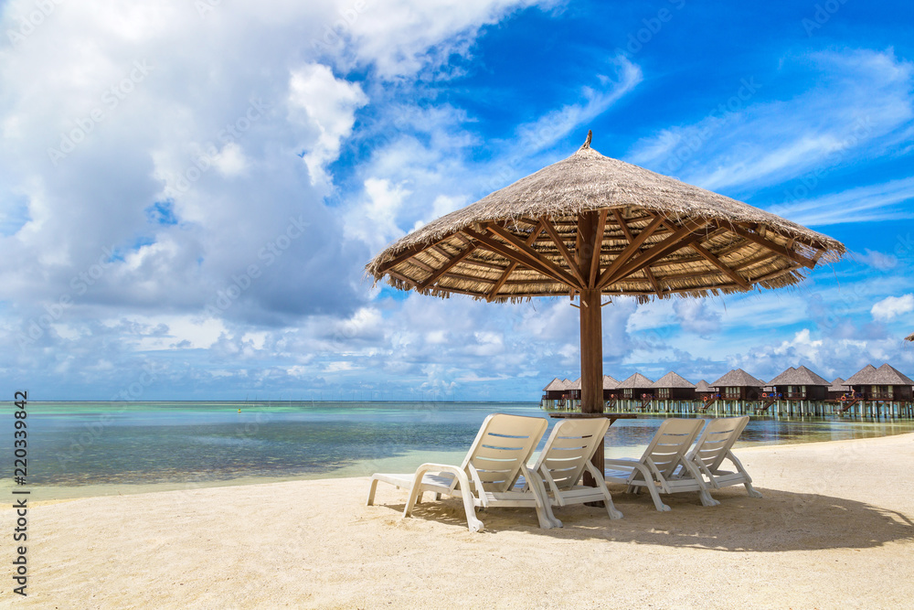 Sunbed and umbrella in the Maldives