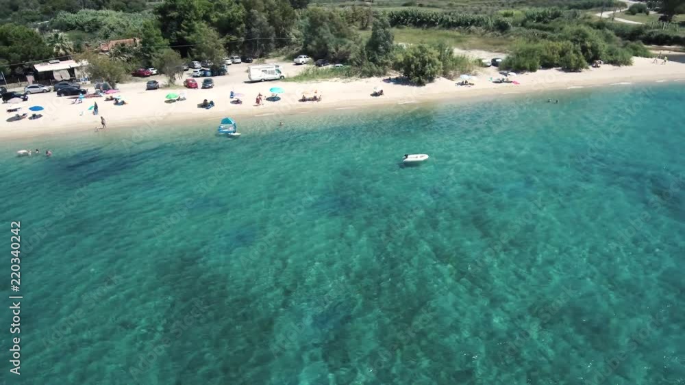 Aerial Greek beach with small boat through drone Aerial Greek beach with small boat through drone