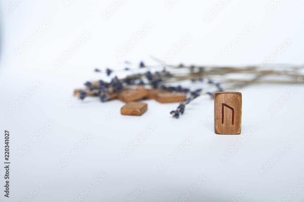 Scandinavian runes. Wooden runes on a table on a white background. Scandinavian runes. Wooden runes on a table on a white background.