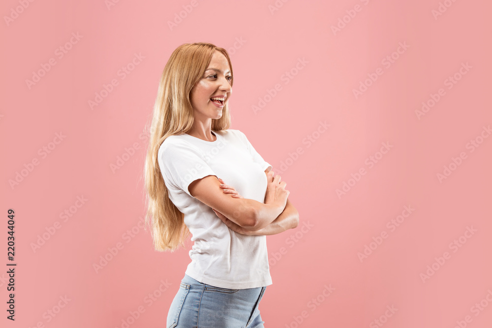 Happy business woman standing and smiling isolated on pink studio background. Beautiful female half-length portrait. Young emotional woman. The human emotions, facial expression concept. Front view. Happy business woman standing and smiling isolated on pink studio background. Beautiful female half-length portrait. Young emotional woman. The human emotions, facial expression concept. Front view.