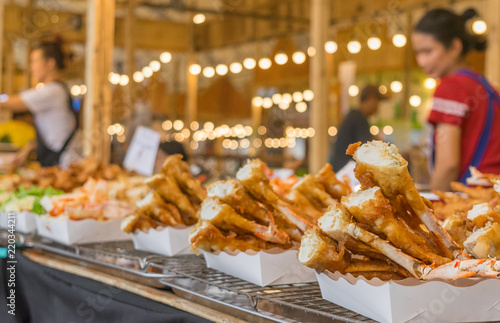 Crispy crab on street food in Thailand in front of festival back