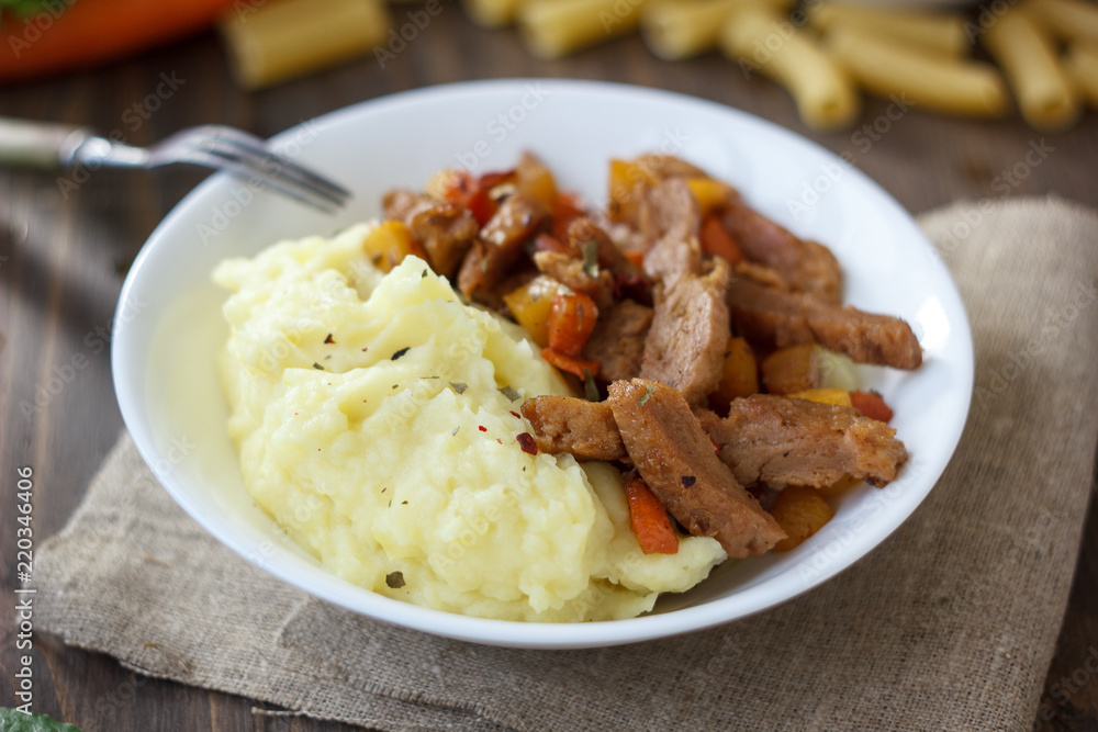 Soy meat with potato puree over kitchen table. Soy meat with potato puree over kitchen table.