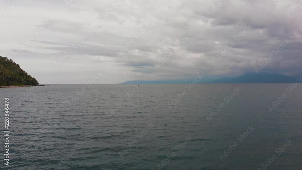 Forward moving drone shot on the water with small Philippine style tourist boats headed towards land. Forward moving drone shot on the water with small Philippine style tourist boats headed towards land.
