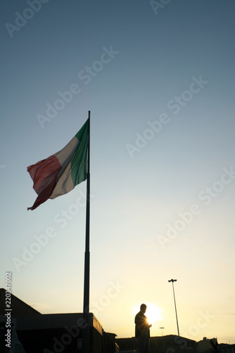 Firenze,Italy-July 26,2018: National flag of Italy flying in the early morning at Firenze Santa Maria Novella station, Florence, Italy 