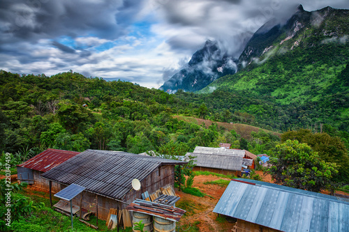 Fotografie Landscape of country house and mountains in the fog at Doi Luang Chiang Dao,Chia
