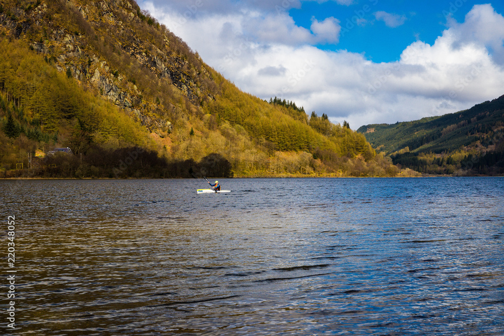 Canoeing in Loch Lubnaig of Scottish Highlands on a sunny spring day Canoeing in Loch Lubnaig of Scottish Highlands on a sunny spring day