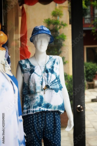 woman clothes model in front of the clothes shop