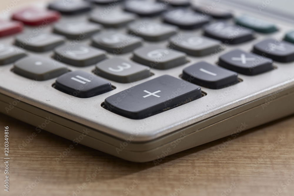 Close-Up Of Old Dirty Calculator On Table Close-Up Of Old Dirty Calculator On Table