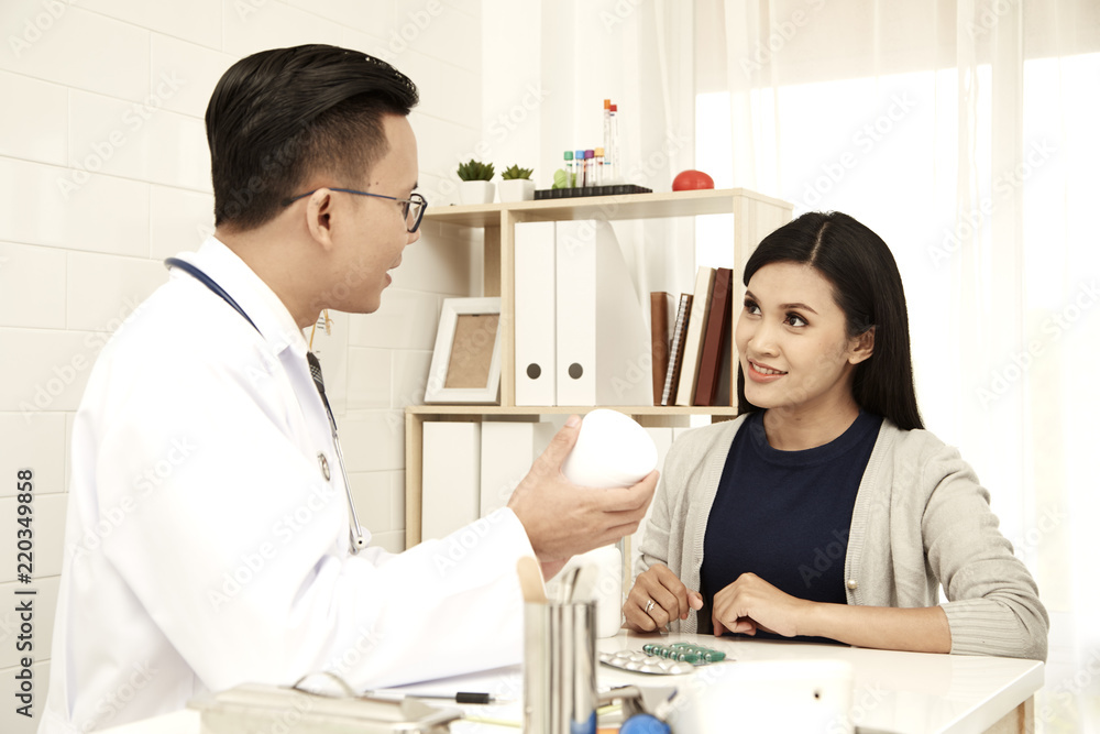 young mother is talking to a doctor
