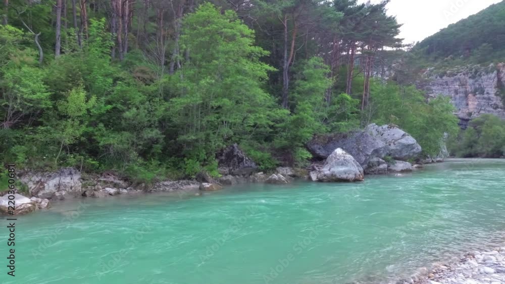 A beautiful turquoise river flows in the mountainous regions of Provence. France. The camcorder rotates smoothly from right to left A beautiful turquoise river flows in the mountainous regions of Provence. France. The camcorder rotates smoothly from right to left