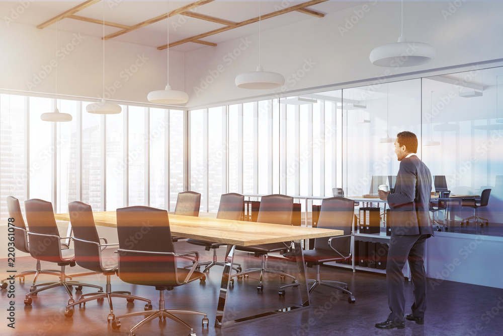 Fototapeta premium Businessman in panoramic meeting room corner, wood