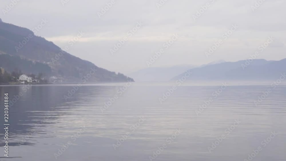 Close to the water pan of a landscape of a fjord in the west coast of Norway_slomo Close to the water pan of a landscape of a fjord in the west coast of Norway_slomo