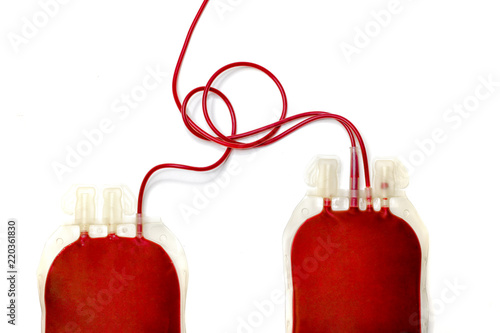 Two bags of donated human blood with no labels. Isolated on white background. Top view directly above with copy space.
