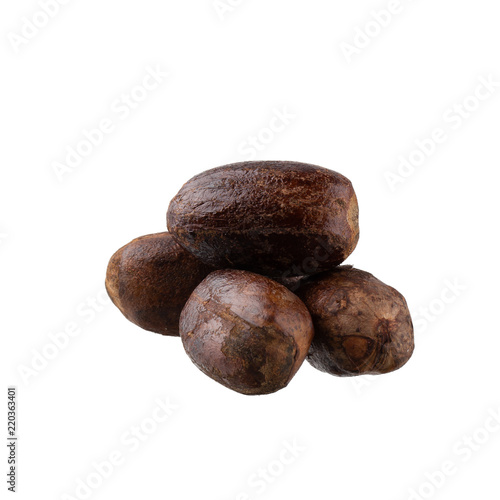 Dry nutmeg spice isolated on a white background