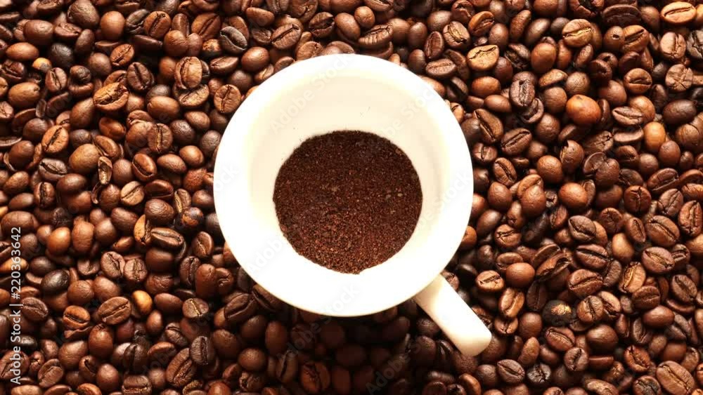 Ground Coffee On The Background Of Grilled Coffee Greens. Ground Coffee On The Background Of Grilled Coffee Greens.