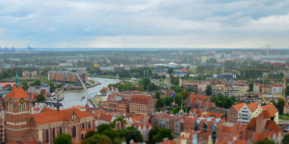 City of Gdansk in Poland, aerial view over the Old Town, view from Saint Mary's Church Tower. Cityscape of Gdansk at cloudy day. Miniature effect. Selective focus