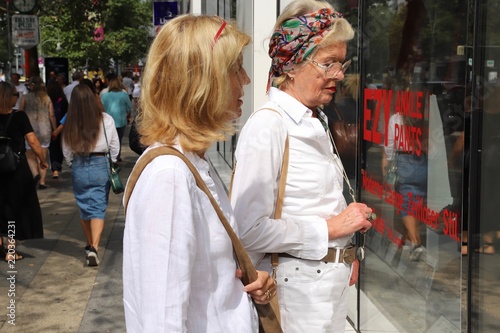 Adult daughter with her mother during shopping at Kurfürstendamm and Tauentzienstraße in Berlin-City, Germany.