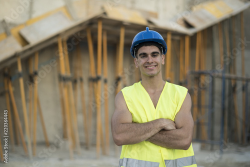 Obraz na płótnie Posing construction worker smiling looking at camera