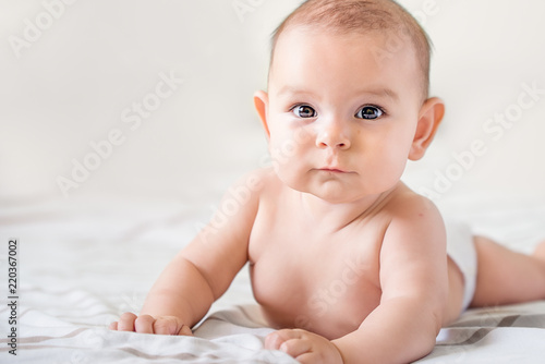 Εκτύπωση καμβά smiling happy newborn infant baby tummy time on bed bright airy copy space child