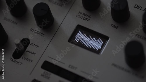 Music composer creating waveform on synthesiser analog sampler photo