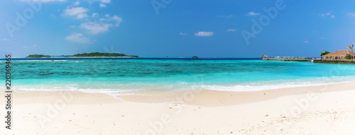 Panoramic view of white sandy Maldivian beach
