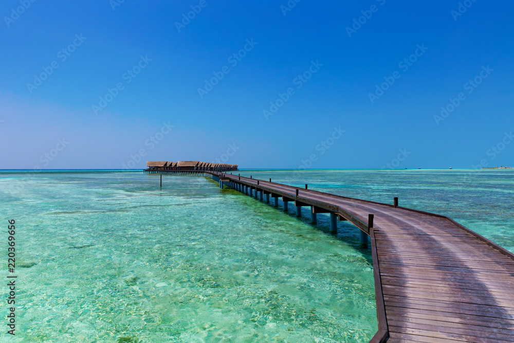 Walkway towards floating holiday villas