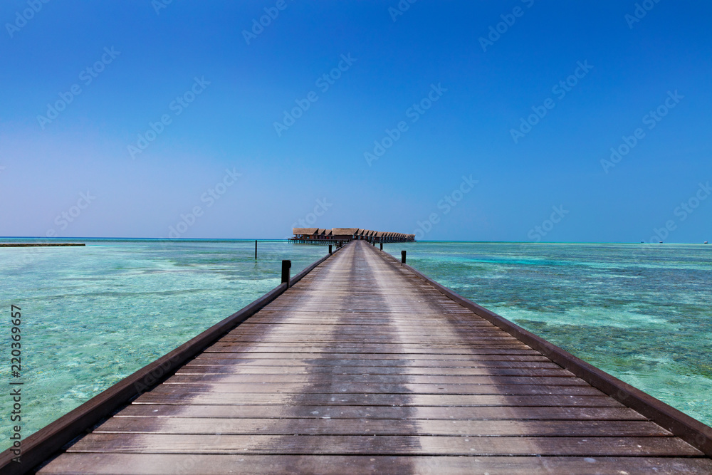 Walkway towards floating holiday villas Walkway towards floating holiday villas