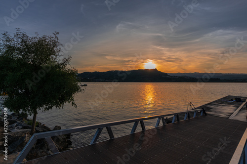 Amazing sunset from the dock of the reservoir of Castrelo de Miño in Ourense, Galicia (Spain).