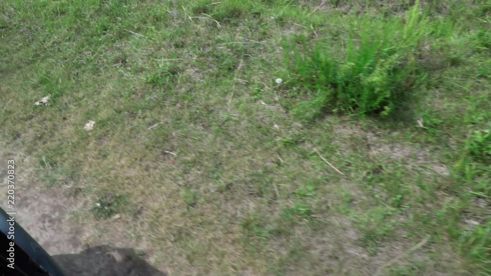 A passengers point of view of driving over farmland, staring at the ground. A passengers point of view of driving over farmland, staring at the ground.