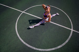beautiful young athletic girl doing stretching outdoor on the basketball court, sports,  healthy lifestyle concept